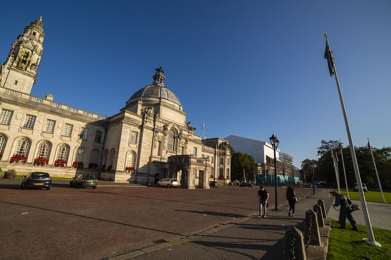 A building with a domed roof set against a blue sky.